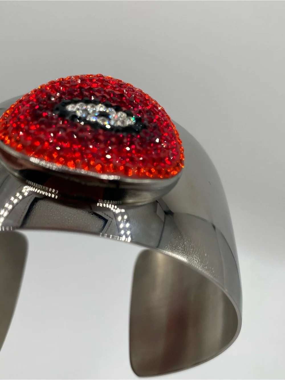 Silver tone Cuff Bracelet with Eclectic Red Crystal Oval Accent